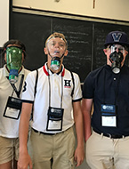 Students wear the breathing apparatuses they worked on during NYLF Explore STEM Alumni