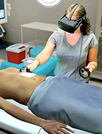 Student performs a surgical procedure using virtual reality (VR) at NYLF Advanced Medicine & Health Care