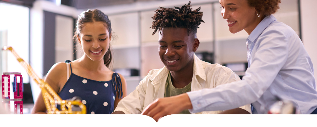 Teacher helping students in a lab