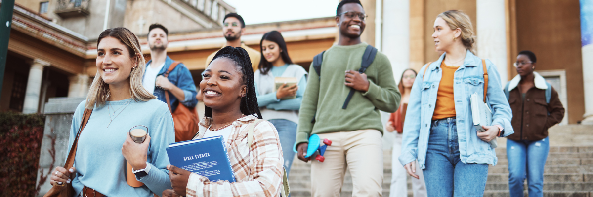 College students coming down building steps